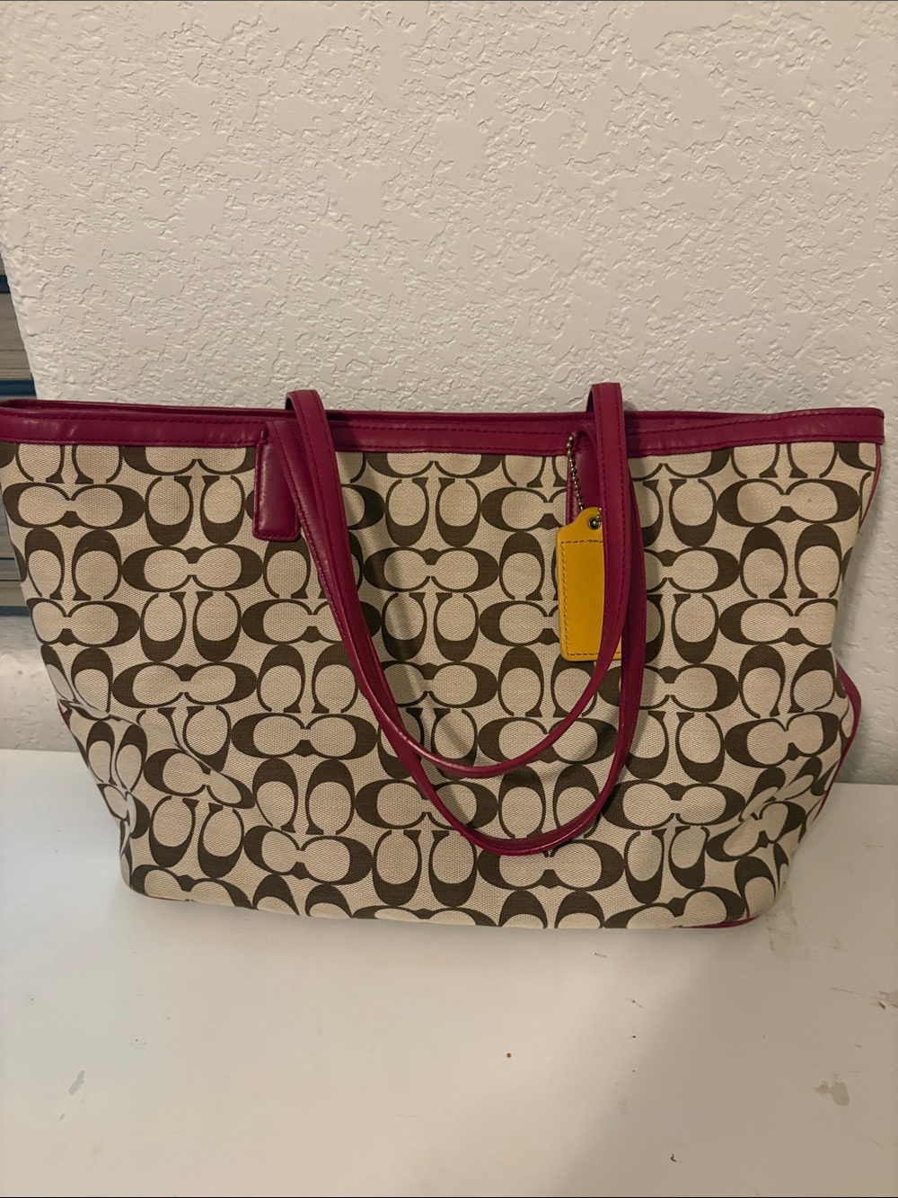 Coach Beige Signature Tote with Pink Trim and Yellow Tag